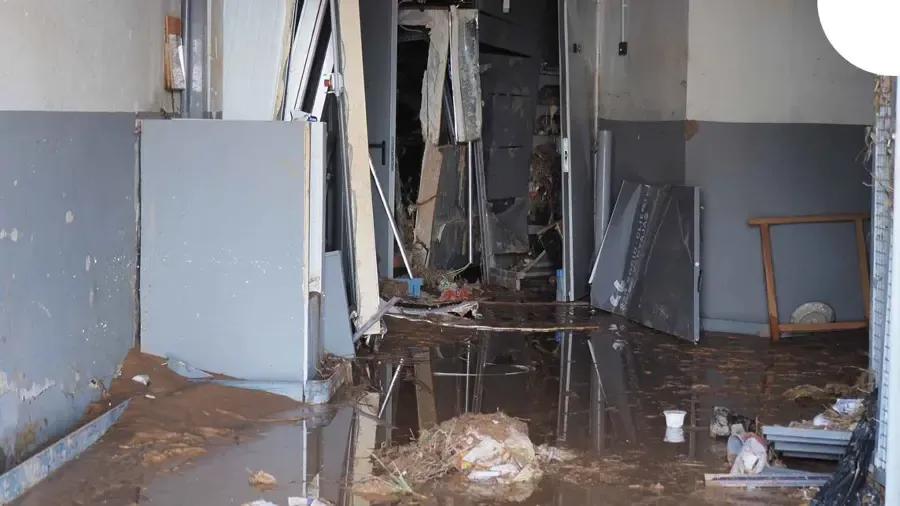Water-damaged wall and ceiling in a League City home after an overflow