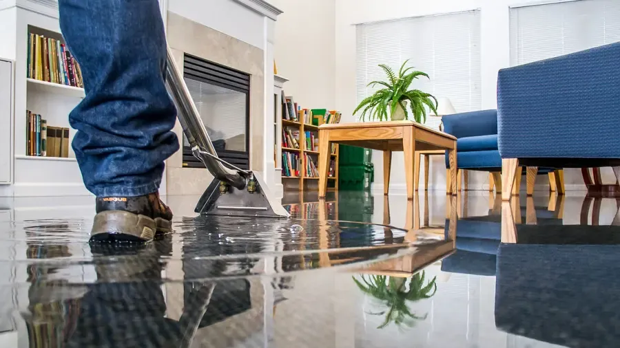 Standing water drying on a tile floor in a League City slab home